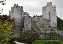 A view of the magnificent Cahir Castle from the banks of the River Suir - The Irish Place