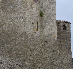 Cannon Ball embedded in the wall of Cahir Castle to the left of the window - The Irish Place