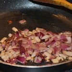 Finely chopped onions frying.