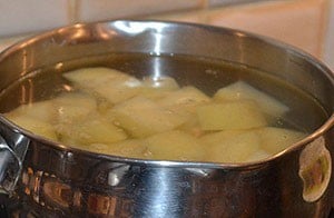 Potatoes peeled, chopped and ready for boiling in salted water - The Irish Place