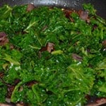 The Kale and onions in the frying pan.