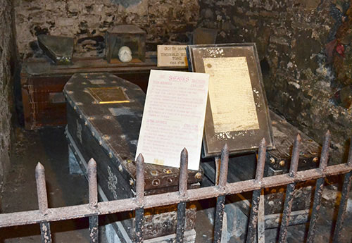 St Michan's Church - The coffins containing the remains of the Sheares Brothers who were hung, drawn and quartered for their part in the 1798 rebellion. Wolfe tones death mask is also visible at the back - The Irish Place