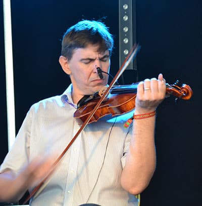 Michael Queally of the Co. Clare band Moher on Fiddle at The Doolin Folk Festival 2016. - The Irish Place