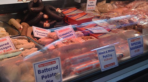 A wide variety of fresh meat is on display on the various butchers stalls in the market. - The Irish Place