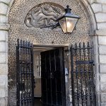 The Front Door of Kilmainham Gaol with the Hydra Motif visible above the door.