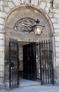 The Front Door of Kilmainham Gaol with the Hydra Motif visible above the door. - The Irish Place