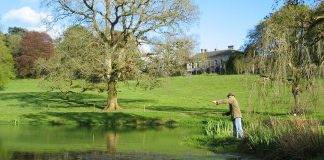 A Fly Fisherman casting his line on one of the lakes in the grounds of Ballyvolane House, Co. Cork - The Irish Place