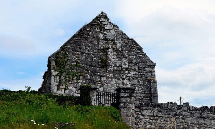 The Cross of Lorraine on the gable wall of Kilnaboy Church - The Irish Place