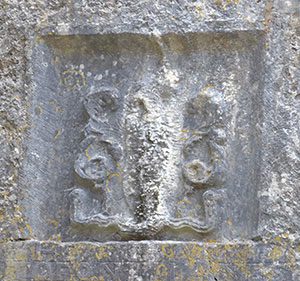 Carving of a creature in the wall of Kilnaboy Church - The Irish Place