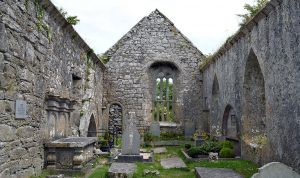 Inside Kilnaboy Church showing the blocked doorway and offset window - The Irish Place