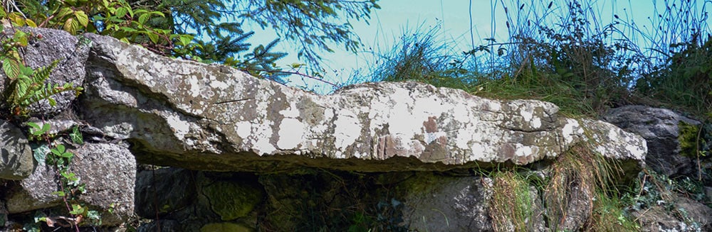 The Ogham Stone used as the lintel in the northern window near the east gable of Seskinan Church - The Irish Place