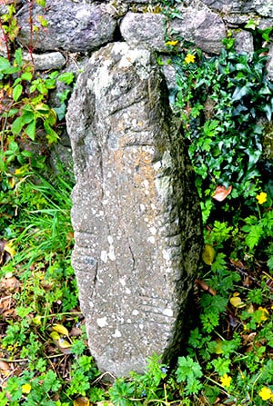 The freestanding Ogham Stone in the Northwest corner in Seskinan Church - The Irish Place