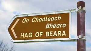 Tourist information signpost by the roadside showing the location of the Hag of Beara